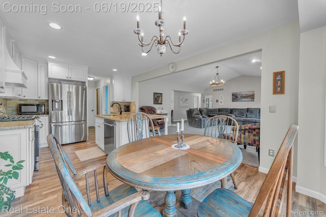 15719 Greenview, Fraser, MI 48026 - dining area featuring a chandelier, light wood-style flooring, recessed lighting, and vaulted ceiling