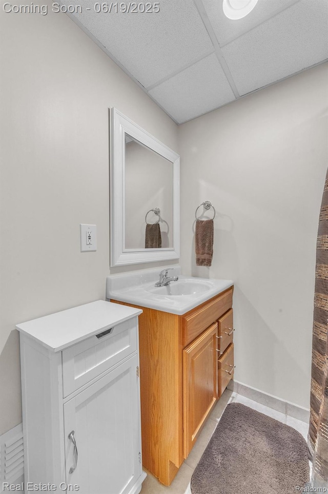 15719 Greenview, Fraser, MI 48026 - bathroom with vanity, a drop ceiling, and tile patterned flooring