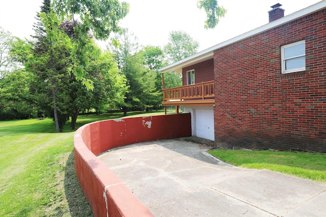 2524 N Mckinley Rd, Flushing, MI 48433 - view of home's exterior with a lawn, a garage, brick siding, concrete driveway, and a chimney