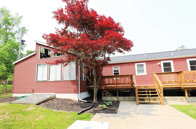 2524 N Mckinley Rd, Flushing, MI 48433 - rear view of house with a wooden deck