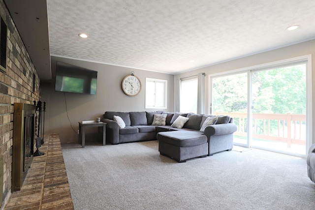 2524 N Mckinley Rd, Flushing, MI 48433 - living room with dark carpet, a fireplace, and recessed lighting