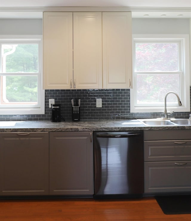 2524 N Mckinley Rd, Flushing, MI 48433 - kitchen with dishwasher, a sink, and dark countertops