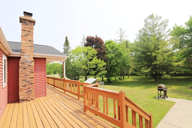 2524 N Mckinley Rd, Flushing, MI 48433 - deck featuring a yard, area for grilling, and view of scattered trees