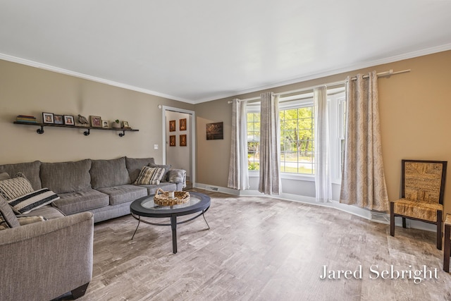 6872 Forest Valley Dr SE, Grand Rapids, MI 49546 - living area featuring ornamental molding, wood finished floors, and baseboards