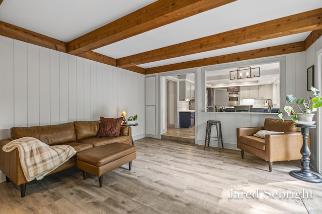 6872 Forest Valley Dr SE, Grand Rapids, MI 49546 - living room with wood finished floors and beamed ceiling