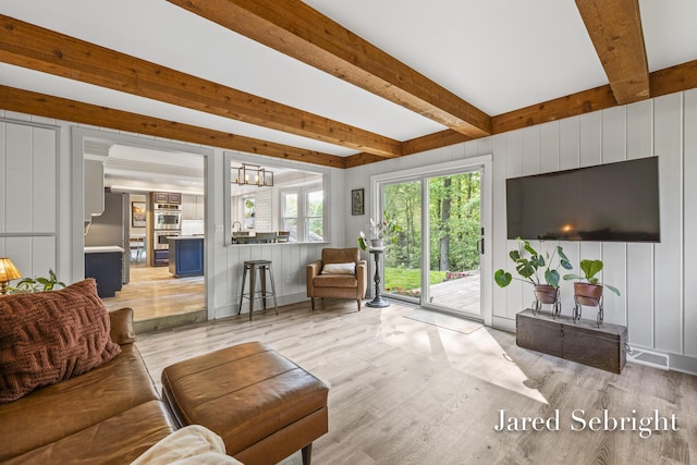 6872 Forest Valley Dr SE, Grand Rapids, MI 49546 - living area featuring light wood-style floors and beam ceiling