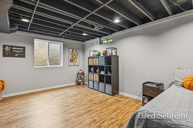 6872 Forest Valley Dr SE, Grand Rapids, MI 49546 - bedroom featuring wood finished floors and baseboards
