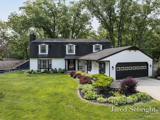 6872 Forest Valley Dr SE, Grand Rapids, MI 49546 - colonial inspired home featuring a chimney, a shingled roof, an attached garage, a front yard, and driveway
