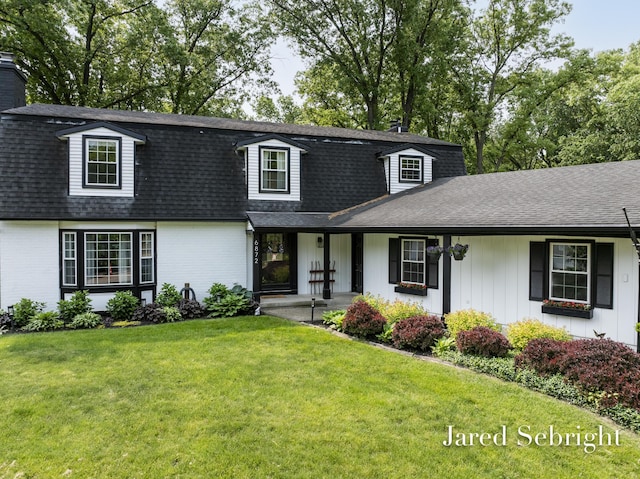 6872 Forest Valley Dr SE, Grand Rapids, MI 49546 - view of front of property featuring brick siding, a shingled roof, and a front yard