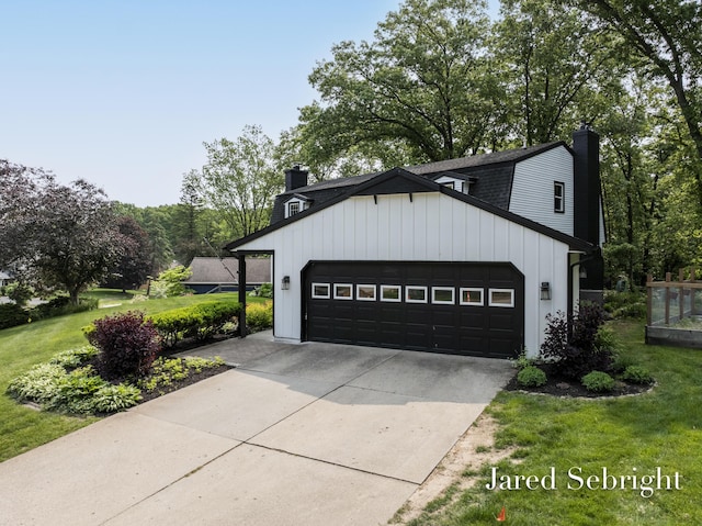 6872 Forest Valley Dr SE, Grand Rapids, MI 49546 - view of front of house with a chimney, a front lawn, an attached garage, and driveway