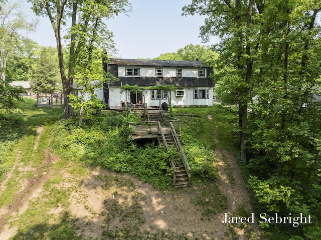6872 Forest Valley Dr SE, Grand Rapids, MI 49546 - back of house featuring stairs, a wooden deck, and roof with shingles