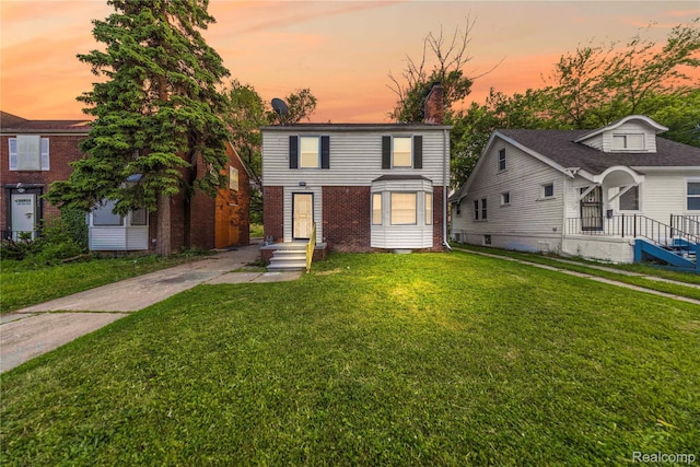 3951 Devonshire Rd, Detroit, MI 48224 - view of front of house featuring a front lawn and brick siding