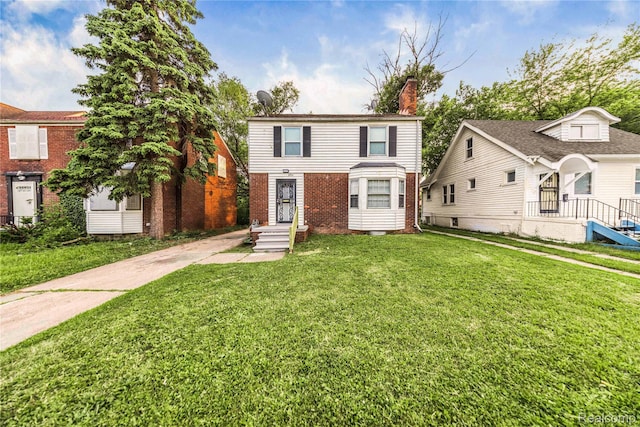 3951 Devonshire Rd, Detroit, MI 48224 - traditional home with a front yard, brick siding, and a chimney