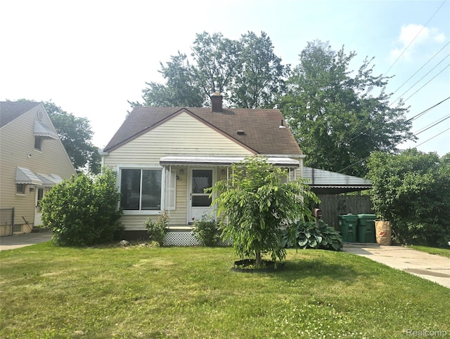 29263 Barton St, Garden City, MI 48135 - view of front of home with a chimney, a front yard, and roof with shingles