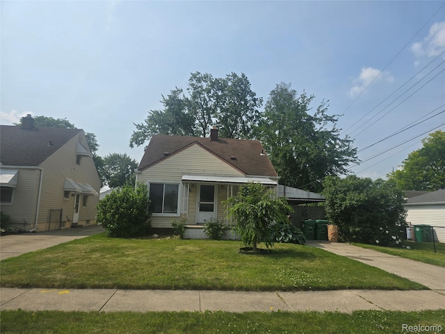 29263 Barton St, Garden City, MI 48135 - bungalow-style house with a front lawn and a chimney