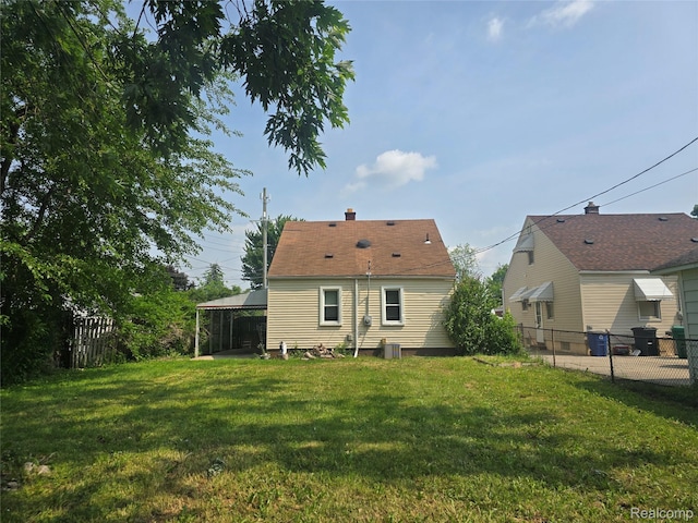29263 Barton St, Garden City, MI 48135 - rear view of house with a fenced backyard