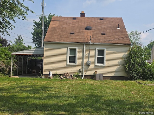 29263 Barton St, Garden City, MI 48135 - rear view of property featuring a chimney and roof with shingles