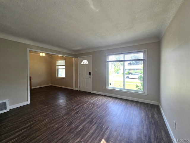 29263 Barton St, Garden City, MI 48135 - foyer entrance featuring a textured ceiling and dark wood-type flooring