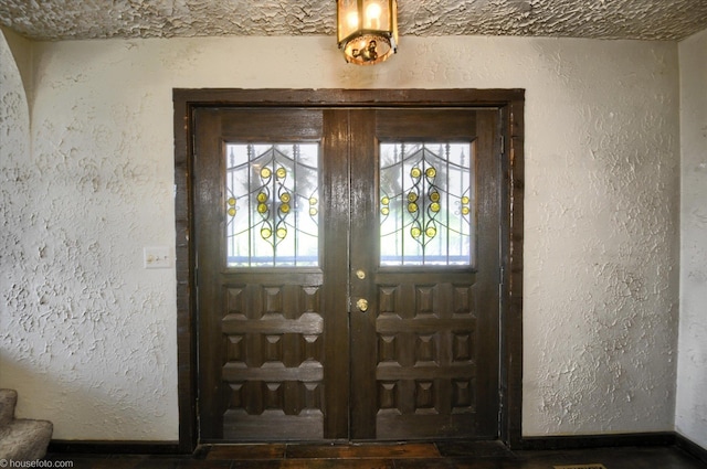 5379 N Irish Rd, Davison, MI 48423 - foyer entrance featuring plenty of natural light, a textured wall, baseboards, and wood finished floors
