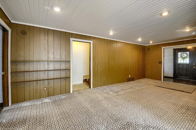 5379 N Irish Rd, Davison, MI 48423 - carpeted empty room featuring recessed lighting, wood walls, and ornamental molding