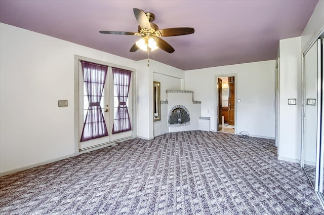 5379 N Irish Rd, Davison, MI 48423 - unfurnished living room with carpet, ceiling fan, and baseboards