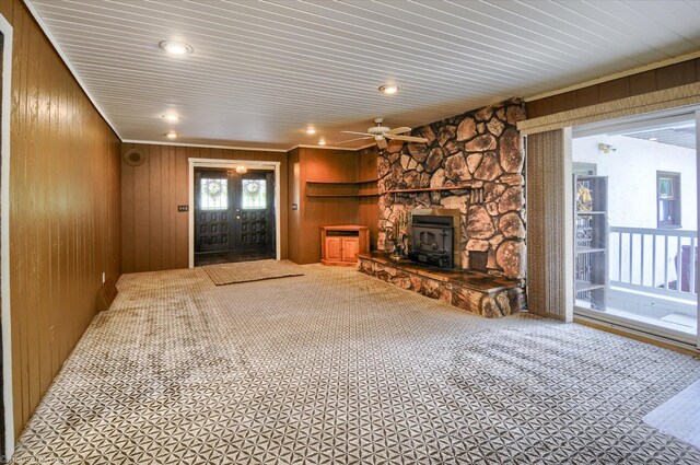 5379 N Irish Rd, Davison, MI 48423 - unfurnished living room with wooden walls, ceiling fan, carpet flooring, a wood stove, and recessed lighting
