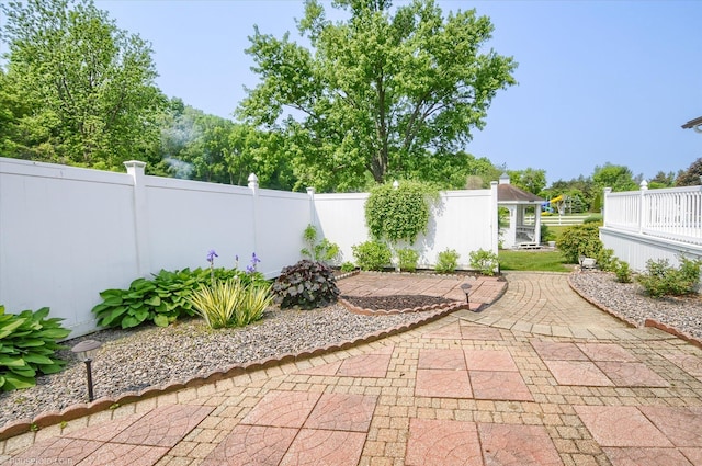 5379 N Irish Rd, Davison, MI 48423 - fenced backyard with a patio area