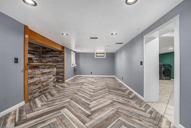 123 Oneida St SW, Wyoming, MI 49548 - spare room featuring washing machine and clothes dryer, baseboards, and recessed lighting