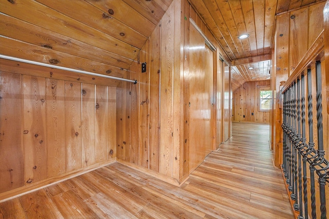 123 Oneida St SW, Wyoming, MI 49548 - corridor featuring light wood-type flooring, wood walls, and wood ceiling