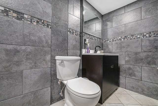 123 Oneida St SW, Wyoming, MI 49548 - half bath with tile walls, toilet, vanity, and tile patterned floors