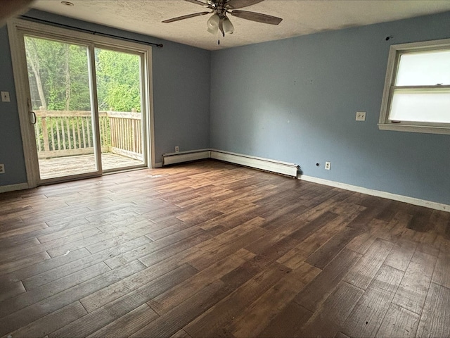 1965 E Kimmel Rd, Jackson, MI 49201 - empty room with a ceiling fan, dark wood-style floors, healthy amount of natural light, and a textured ceiling