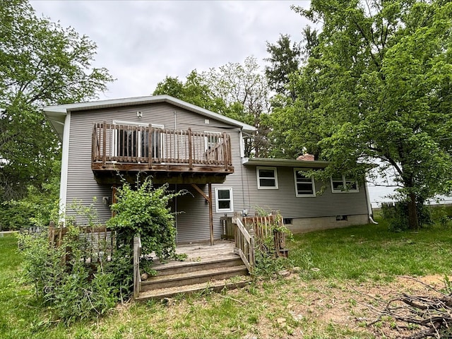 1965 E Kimmel Rd, Jackson, MI 49201 - rear view of property with a deck, a chimney, and a yard