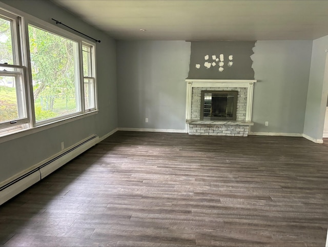 1965 E Kimmel Rd, Jackson, MI 49201 - unfurnished living room with a baseboard radiator, wood finished floors, baseboards, and a fireplace