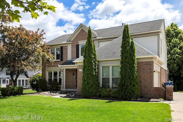 47951 Picadilly Ct, Canton, MI 48187 - traditional-style home with brick siding, a front lawn, and a shingled roof