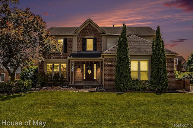 47951 Picadilly Ct, Canton, MI 48187 - traditional home with brick siding, a yard, and roof with shingles