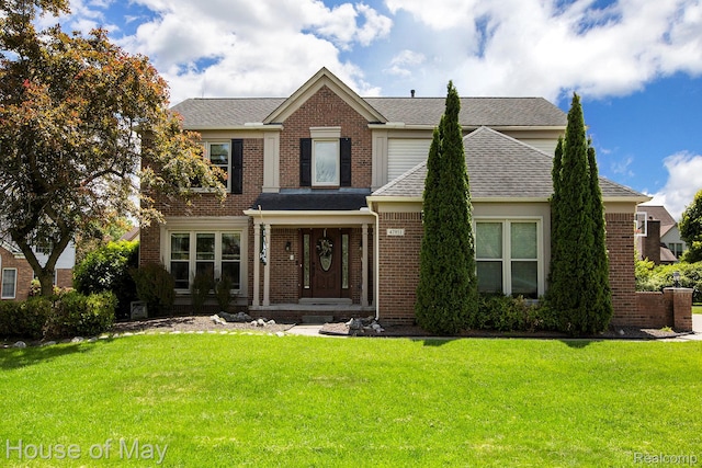 47951 Picadilly Ct, Canton, MI 48187 - traditional-style home featuring brick siding, a front lawn, and roof with shingles