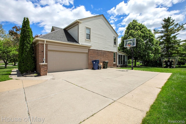 47951 Picadilly Ct, Canton, MI 48187 - view of side of home featuring brick siding, concrete driveway, a garage, and a yard