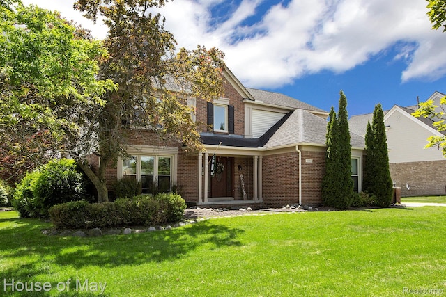 47951 Picadilly Ct, Canton, MI 48187 - traditional home with brick siding, a front yard, and a shingled roof