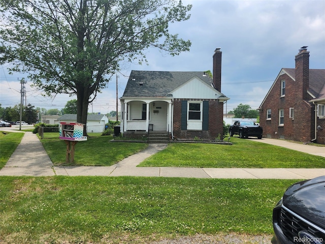 25401 Southwick, Redford, MI 48240 - bungalow-style home featuring a front lawn, covered porch, and brick siding