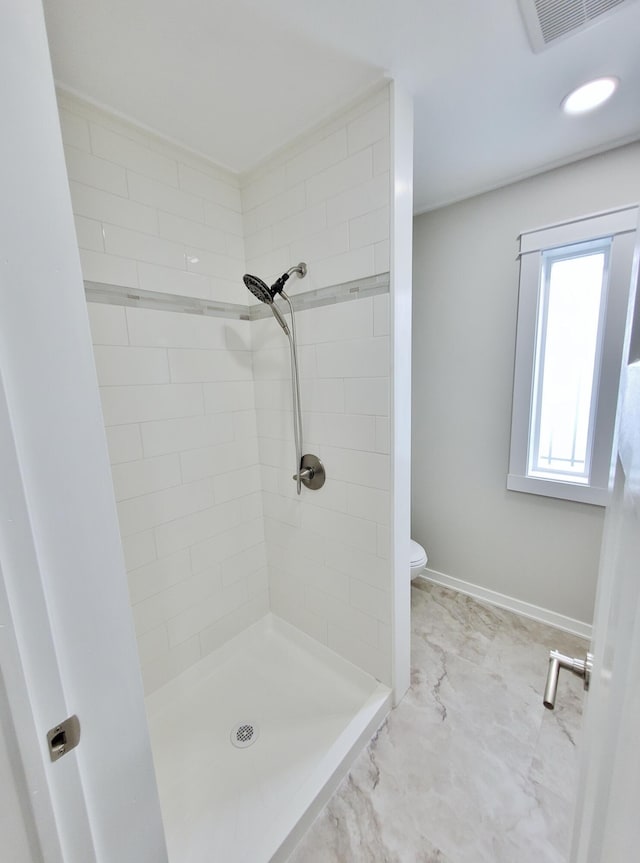 121 S Marshall St, New Buffalo, MI 49117 - full bath with a shower stall, toilet, baseboards, and marble look tile flooring