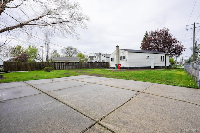 16282 Evergreen Ave, Eastpointe, MI 48021 - back of property featuring a patio area and a chimney