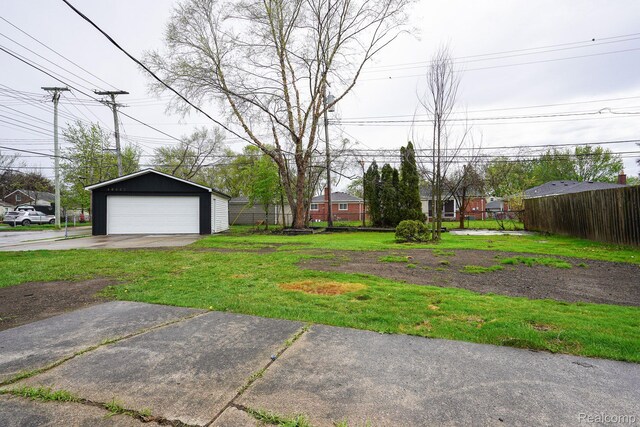 16282 Evergreen Ave, Eastpointe, MI 48021 - view of yard with a garage and an outbuilding