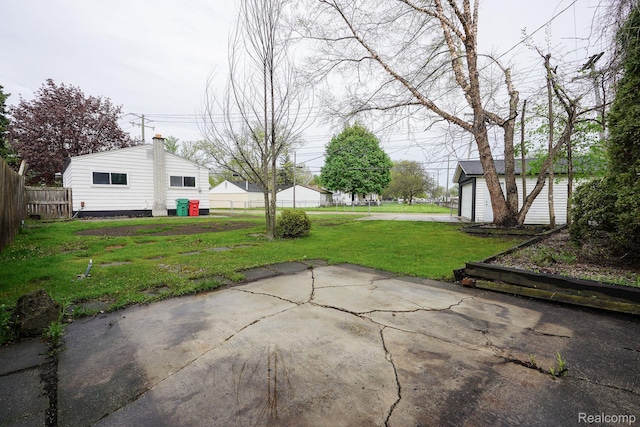 16282 Evergreen Ave, Eastpointe, MI 48021 - view of patio / terrace with an outdoor structure and a garage
