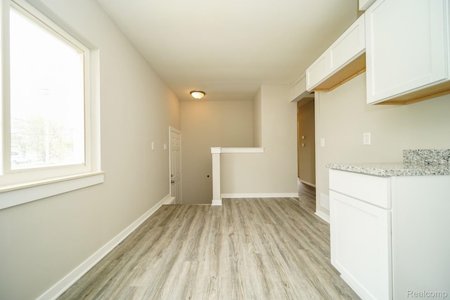 16282 Evergreen Ave, Eastpointe, MI 48021 - unfurnished dining area with light wood finished floors and baseboards