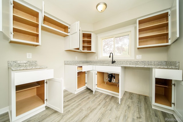 16282 Evergreen Ave, Eastpointe, MI 48021 - laundry area with light wood finished floors, a desk, and a sink