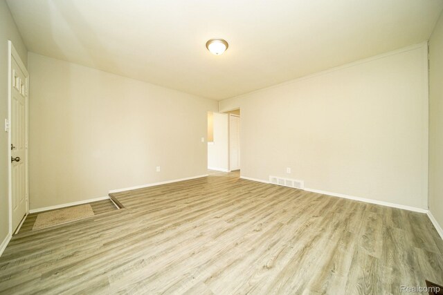 16282 Evergreen Ave, Eastpointe, MI 48021 - empty room featuring wood finished floors and baseboards