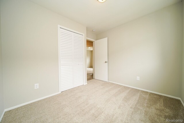 16282 Evergreen Ave, Eastpointe, MI 48021 - unfurnished bedroom featuring carpet floors, a closet, and baseboards