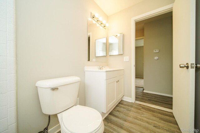 16282 Evergreen Ave, Eastpointe, MI 48021 - bathroom with vanity, wood finished floors, toilet, and baseboards