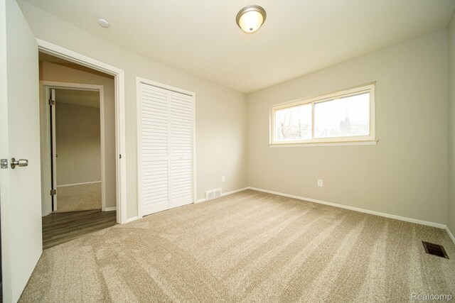 16282 Evergreen Ave, Eastpointe, MI 48021 - unfurnished bedroom with carpet flooring, a closet, and baseboards