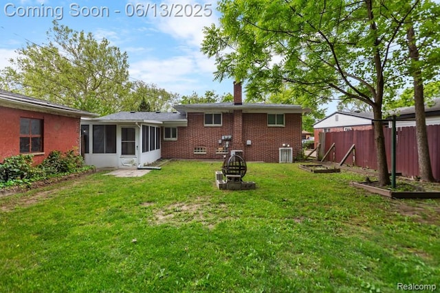 32702 Winona St, Westland, MI 48185 - back of property featuring a sunroom and brick siding